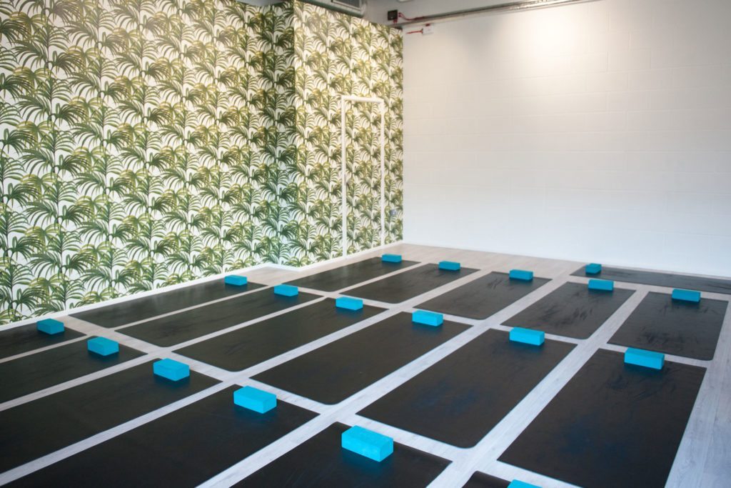 Fitness studio with mats arranged on the floor