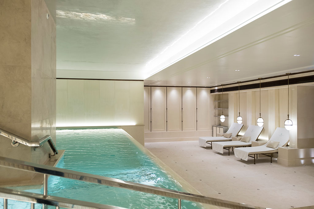 Indoor pool with loungers to the side