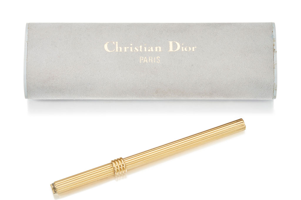 A BALL POINT PEN, BY CHRISTIAN DIOR Reeded decoration throughout, with similarly designed detachable lid, 9.5cm, in fitted Christian Dior case Signed Christian Dior Estimate £800 - 1,200 