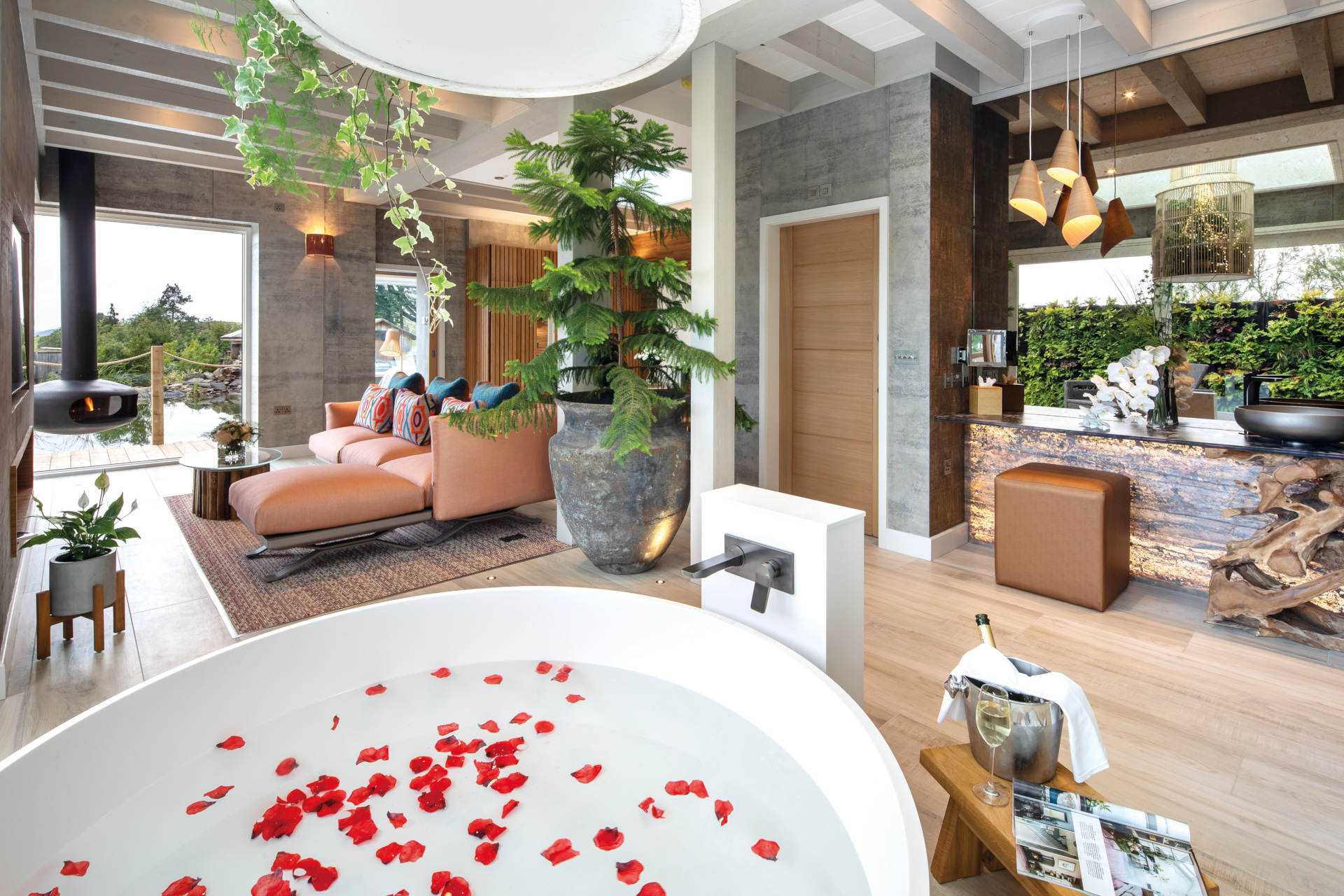Indoor bath with rose petals and open plan room