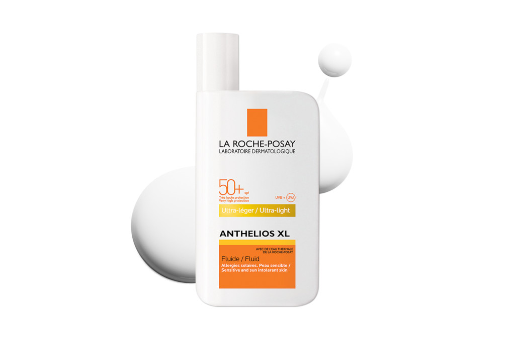White and orange bottle of SPF cream