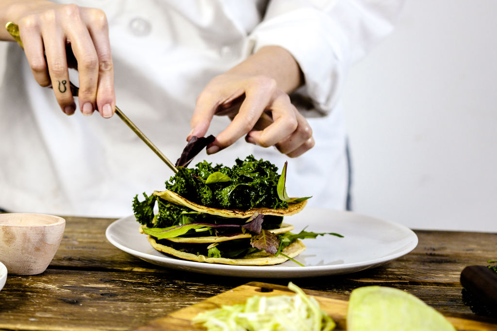 Person cooking at The Plant Based Academy