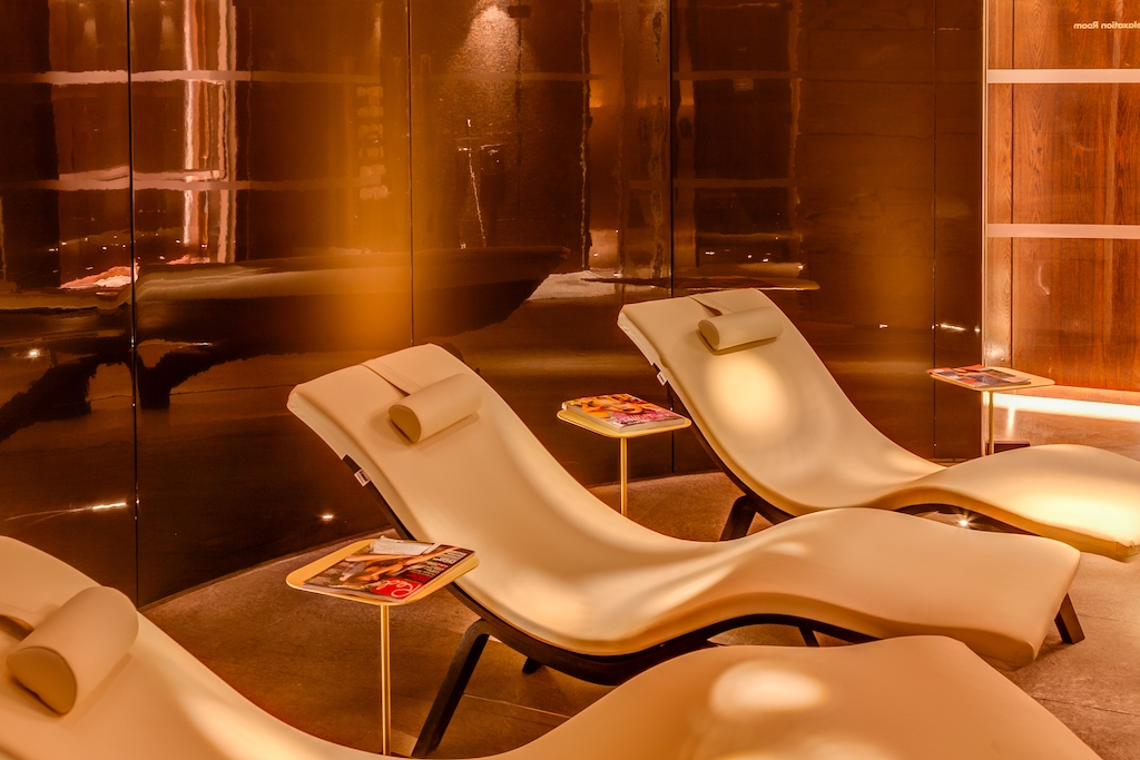 Orange-lit room with loungers at Cloud Twelve Spa