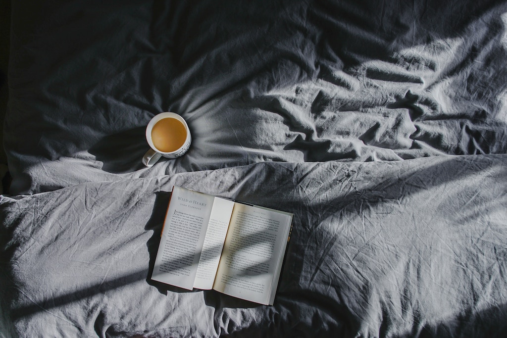 Tea and Book on Bed