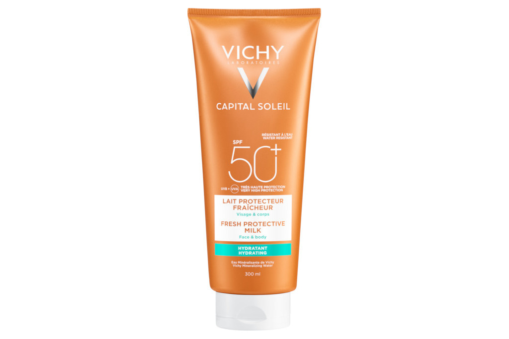 Orange bottle of face and body SPF cream