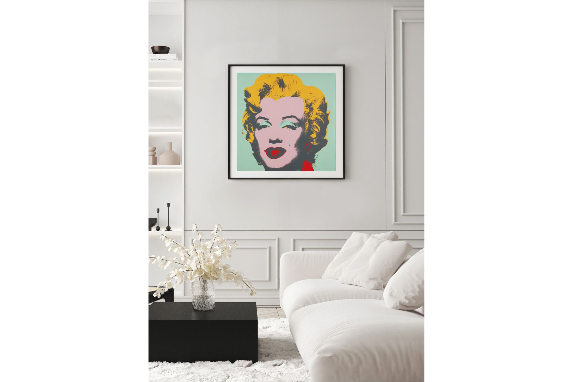 A painting of Marilyn Monroe by Andy Warhol on a wall