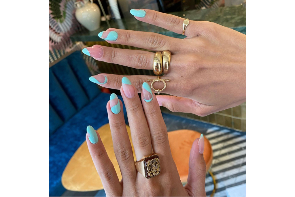 Close up of hands and blue nails