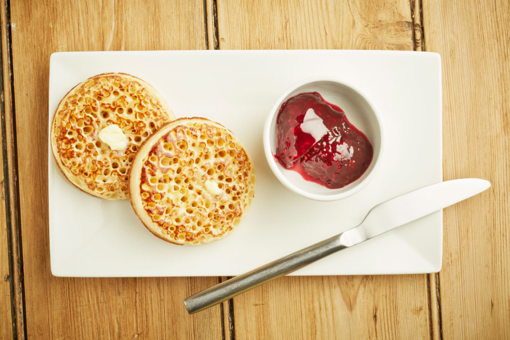 Crumpets with jam and butter