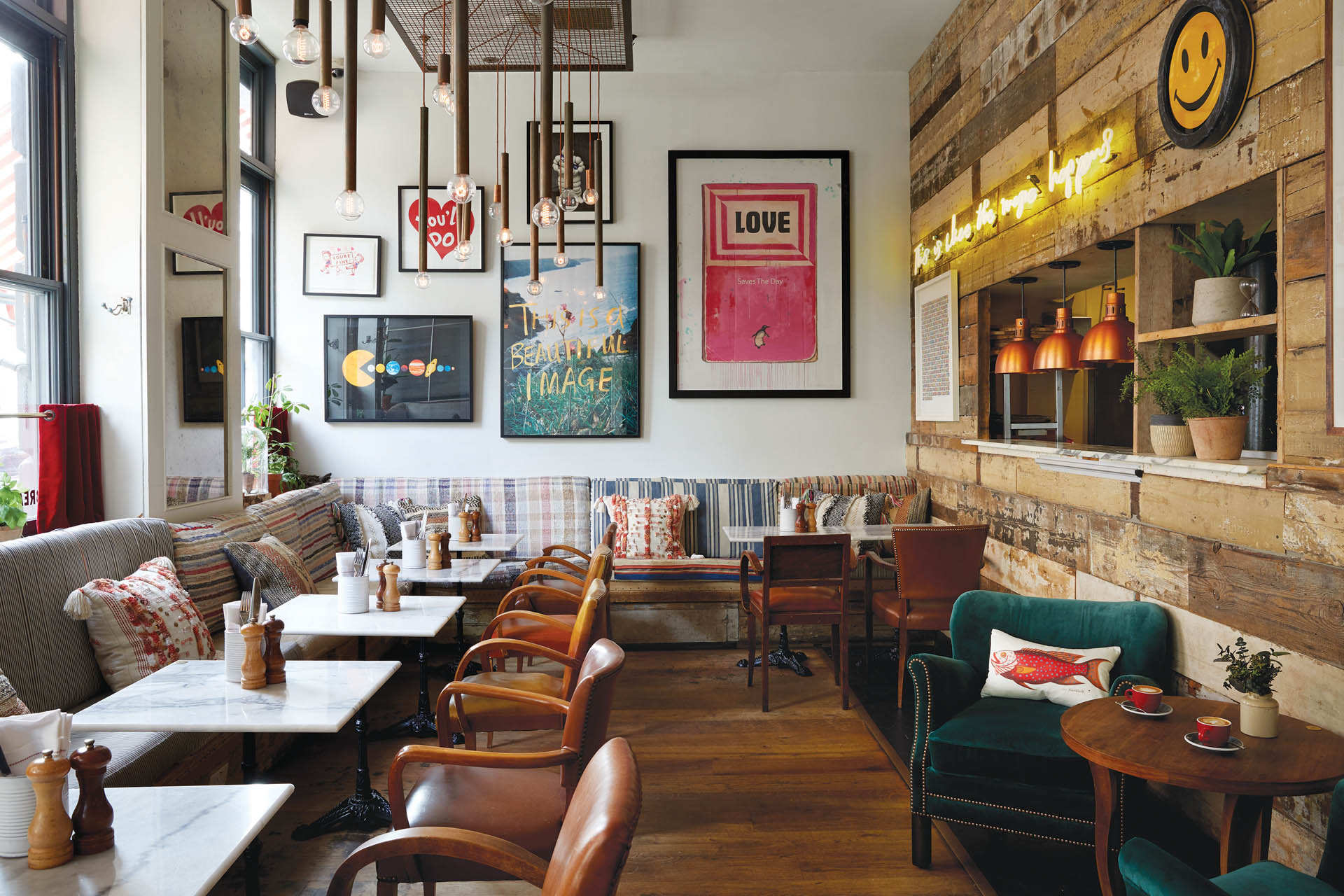 Dining room with tables, chairs and sofas