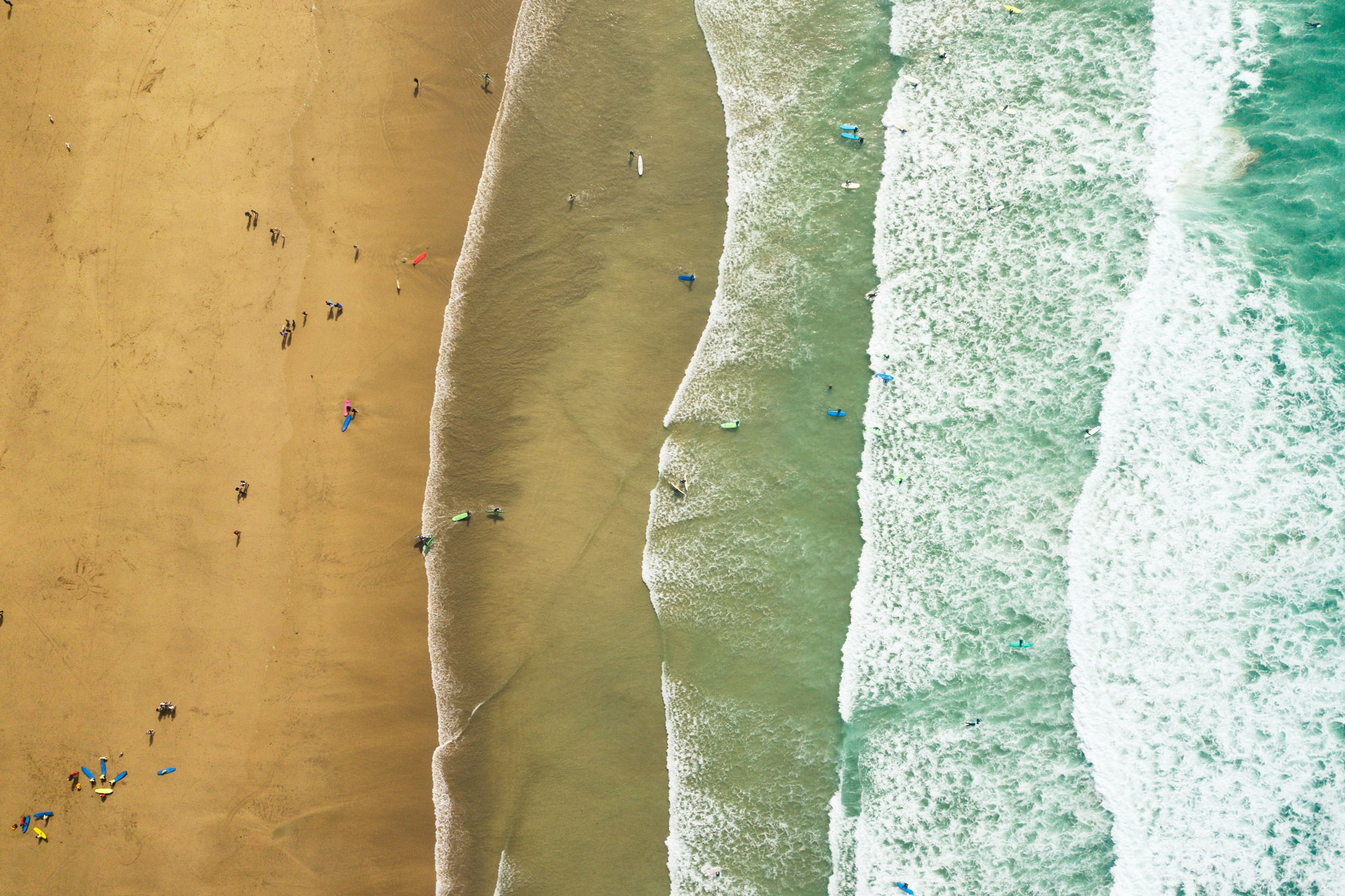 surfers on the beach at Newquay