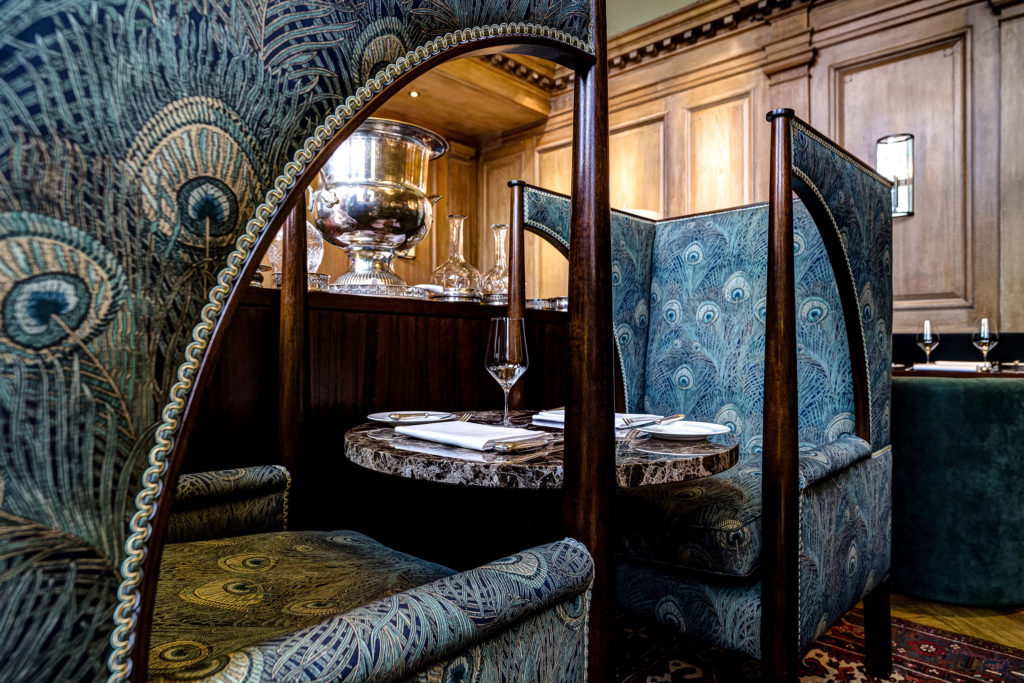 67 Pall Mall seating area with peacock pattern armchairs