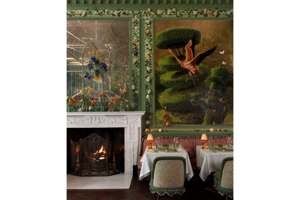 Annabel's Rose Room fireplace, dining tables and wall mural