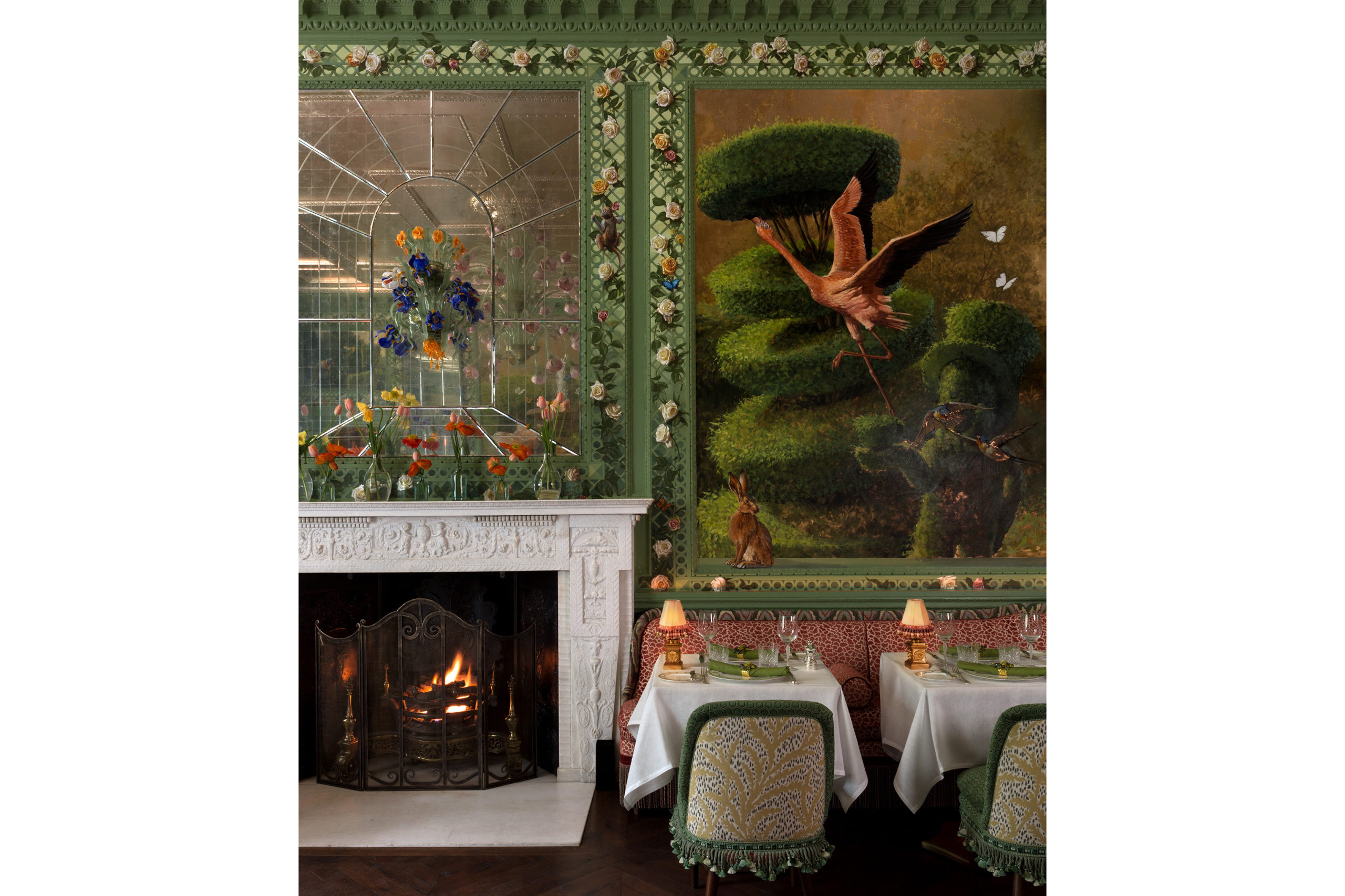 Annabel's Rose Room fireplace, dining tables and wall mural