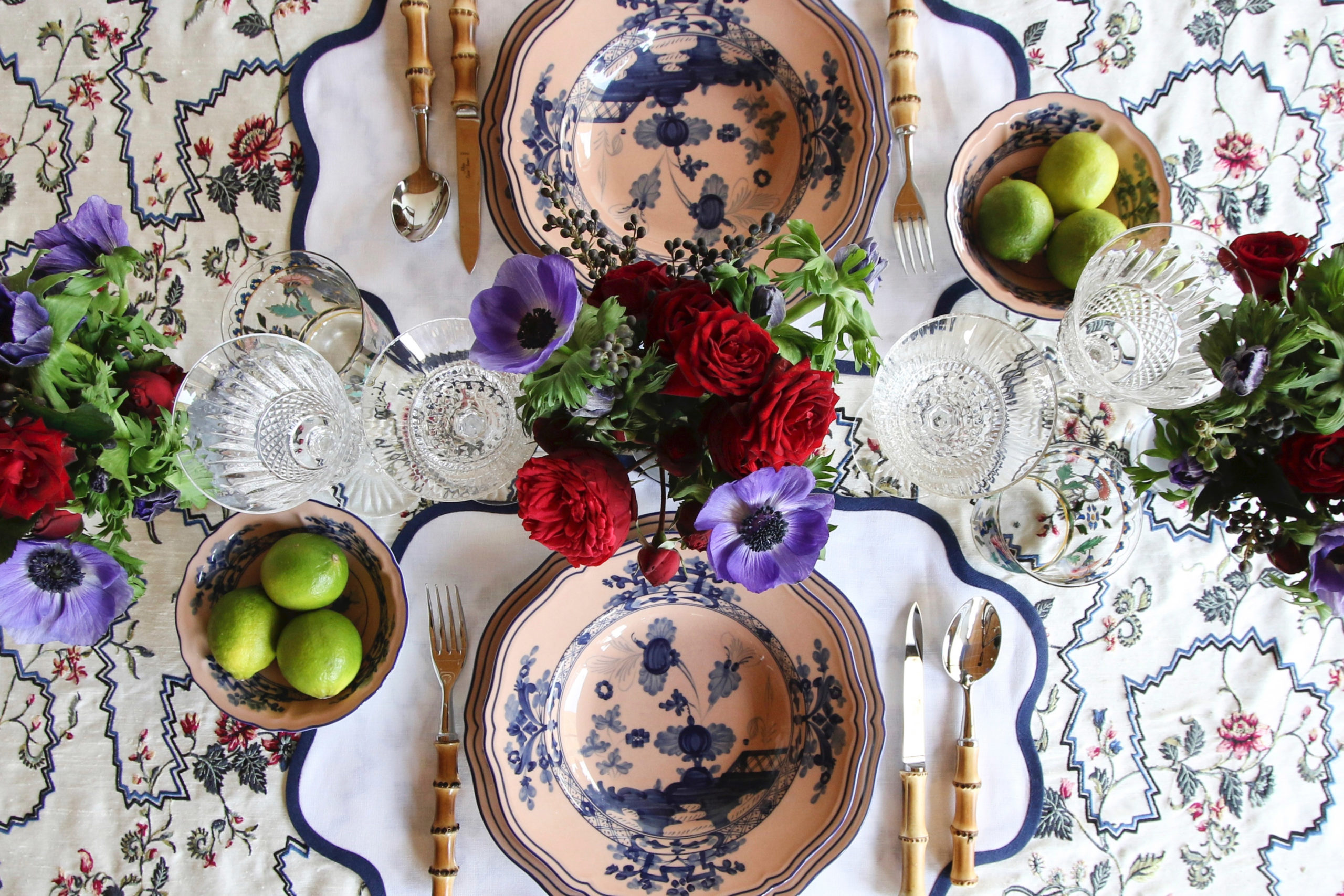 Two Bonadea colourful table settings with blue and pink china