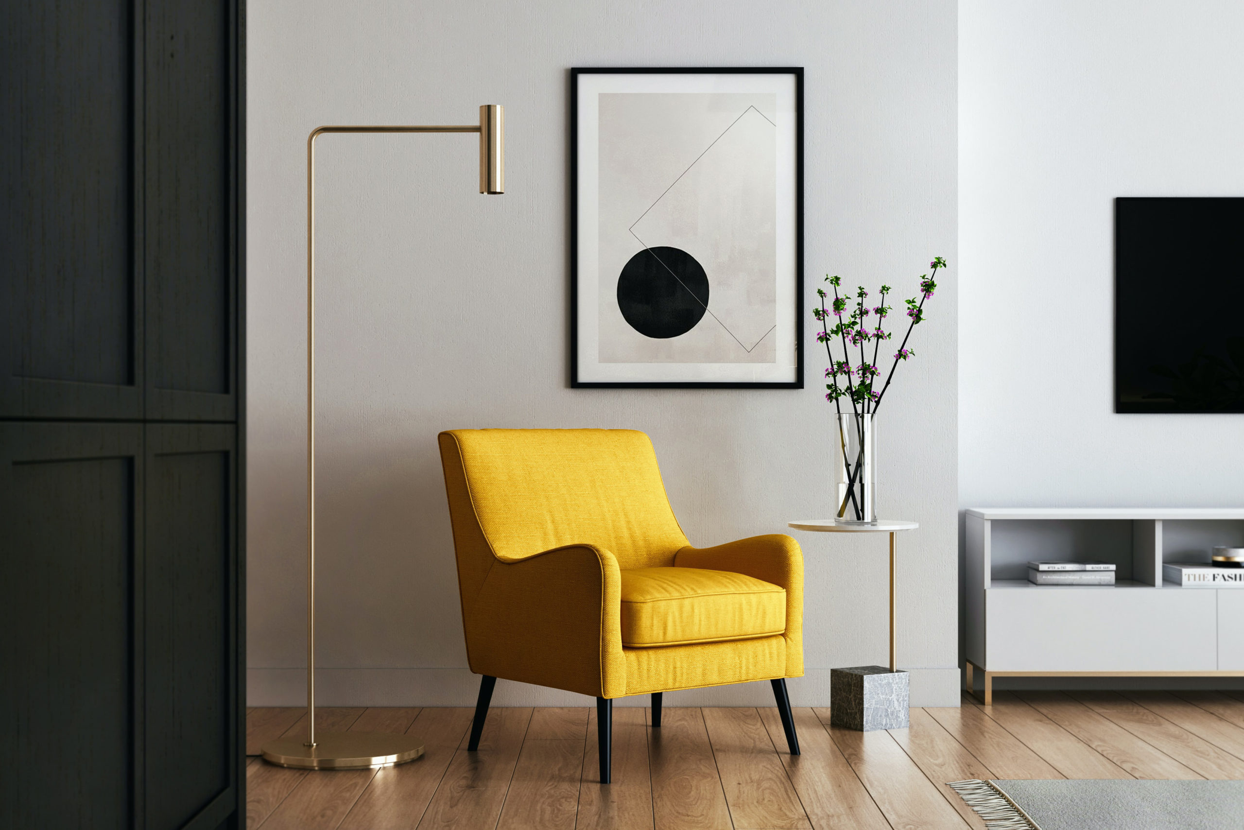 Yellow chair in modern room with white walls, brass lamp and art print