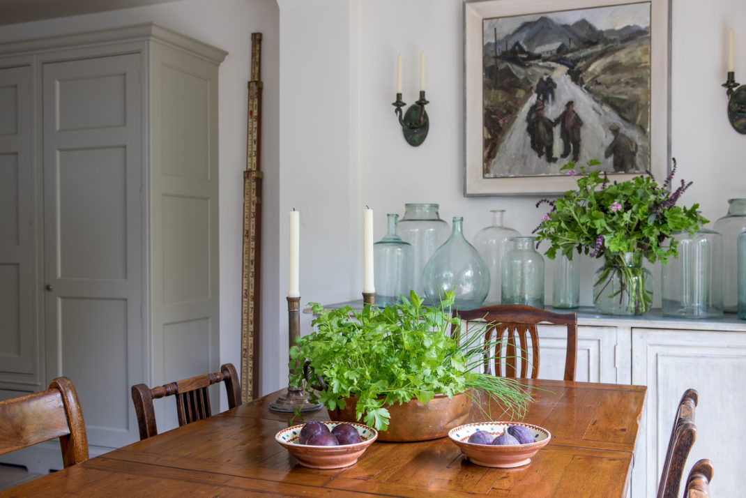 Wooden dining table and chairs with candlesticks