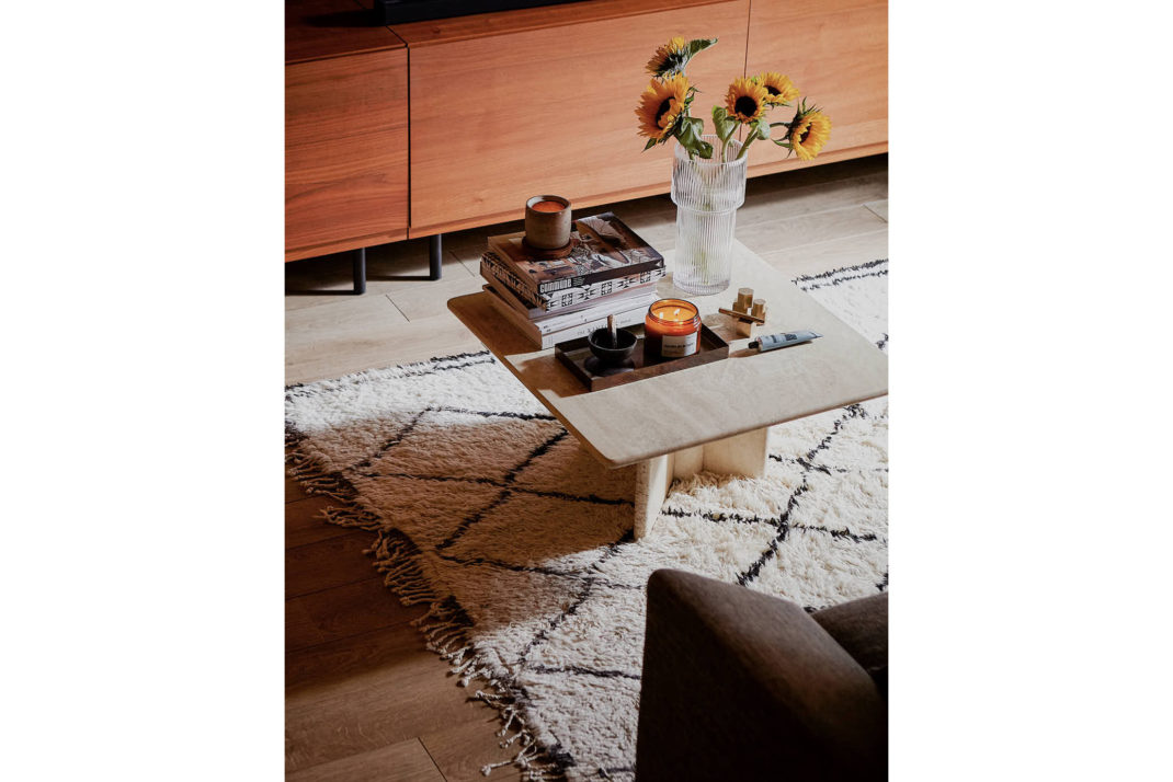 Decor detail: geometric rug, wooden coffee table