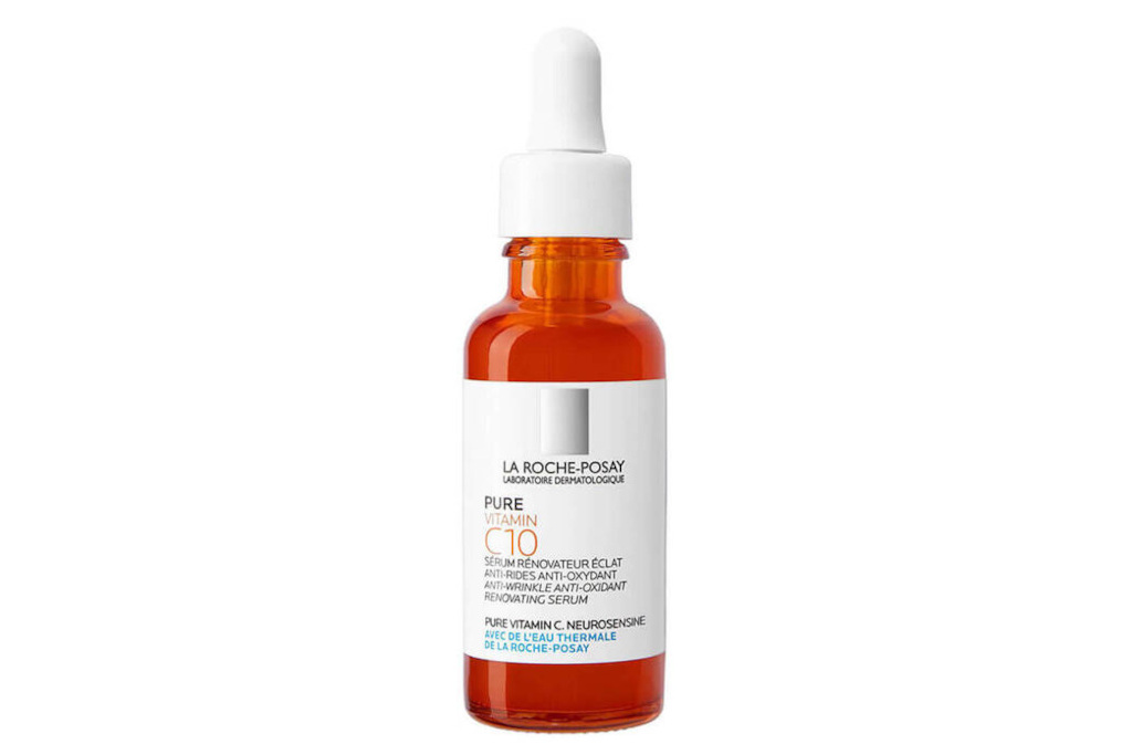 Orange serum bottle with white label and stopper