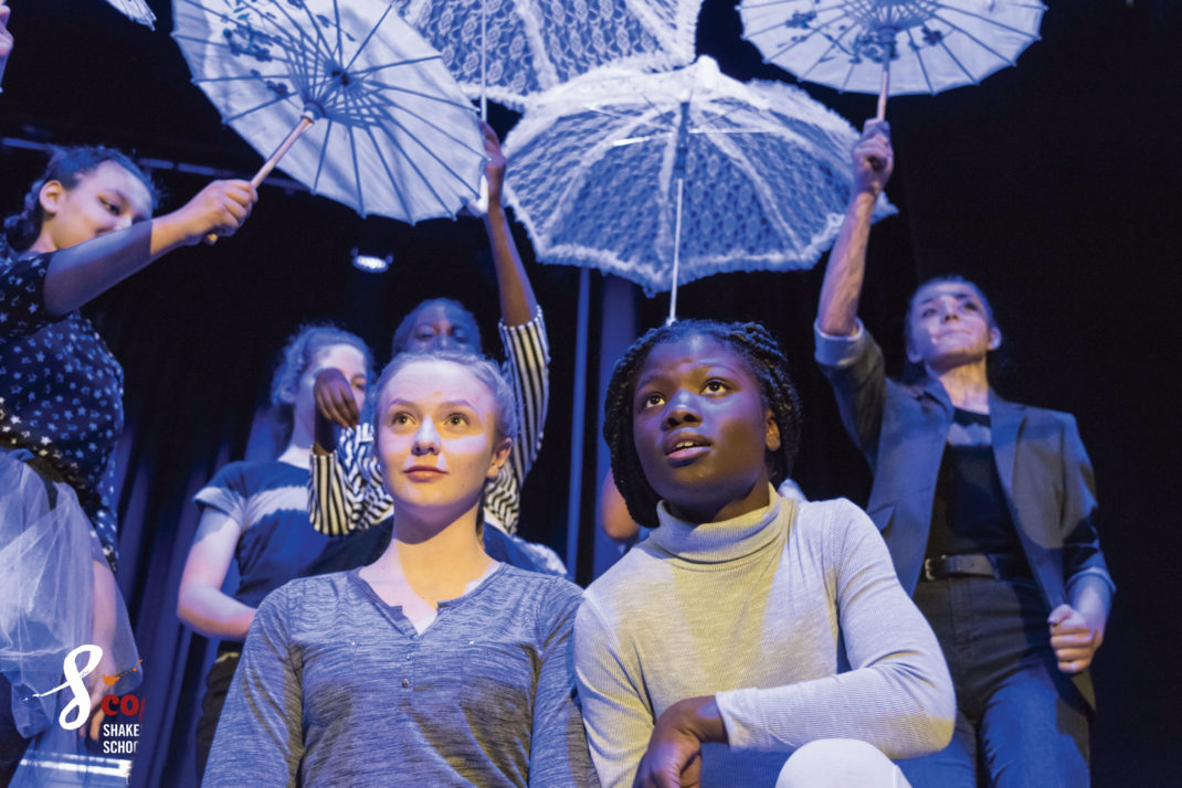 Shakespeare for Schools: two children, parasols in background
