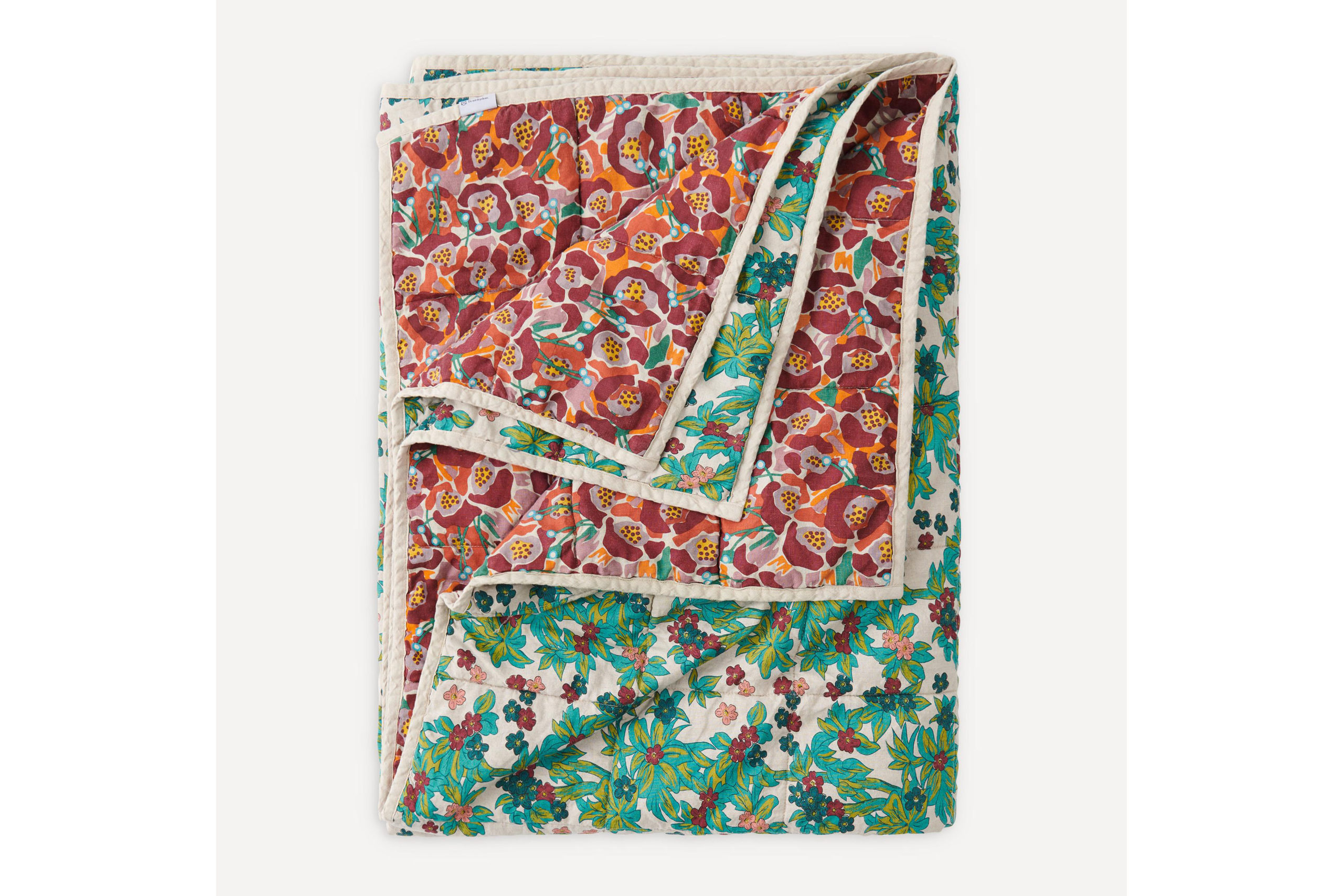 Red and green patterned bed throw