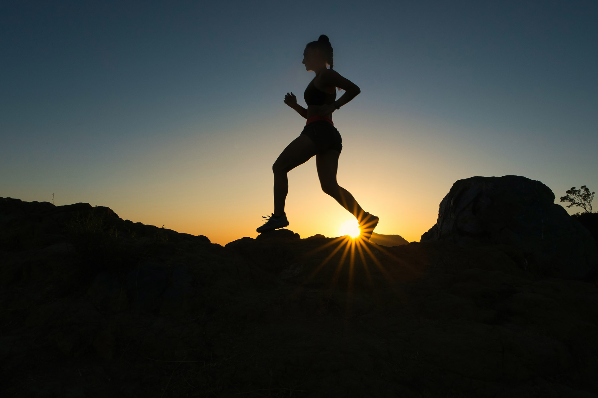 Silhouette or woman running