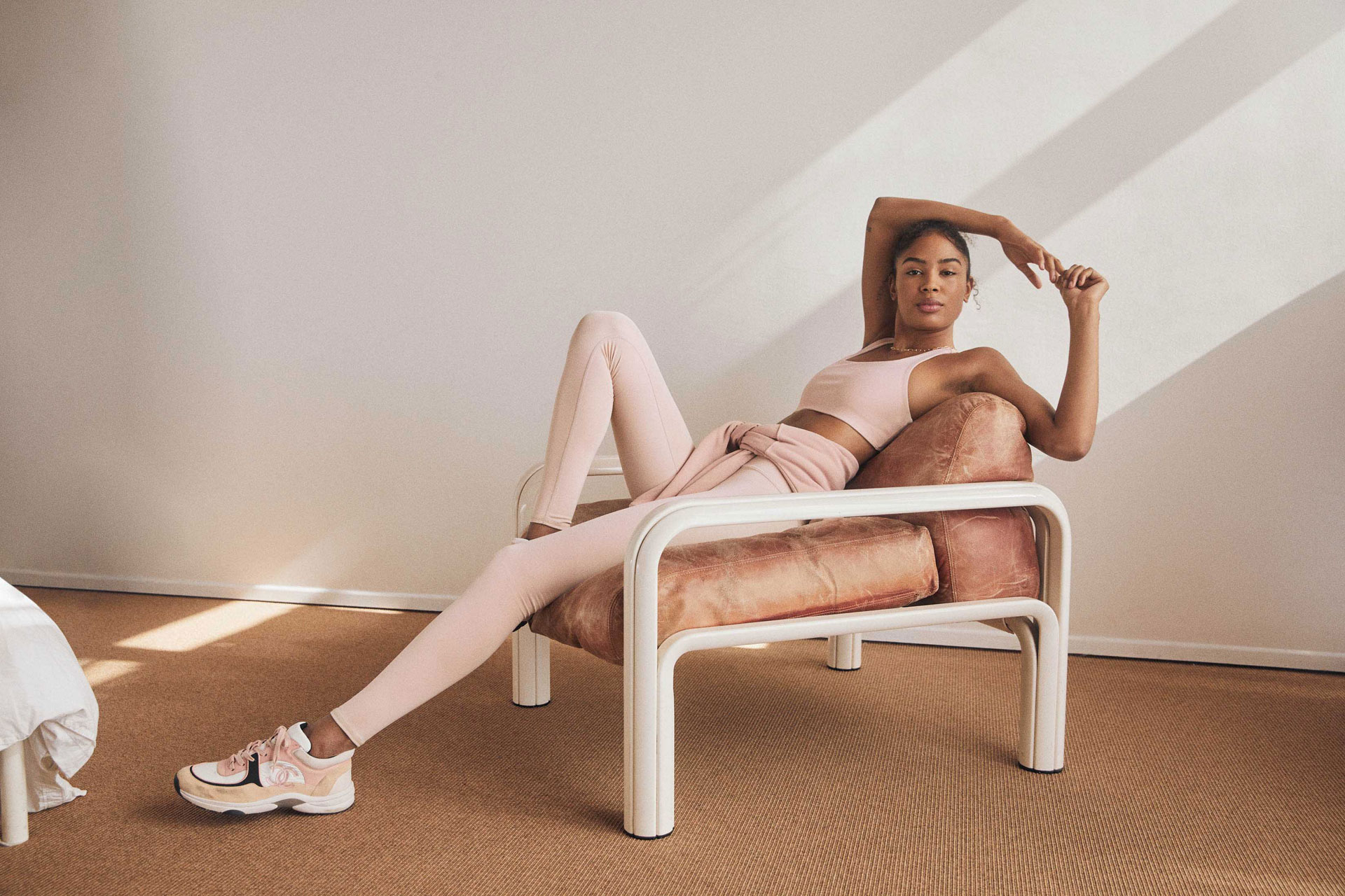 Woman on chair in activewear