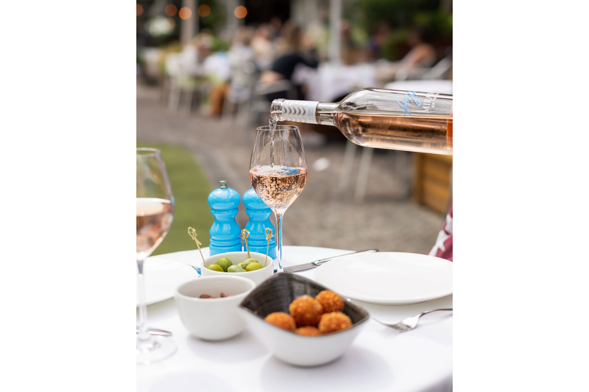 Rose wine being poured at Bluebird restaurant in London