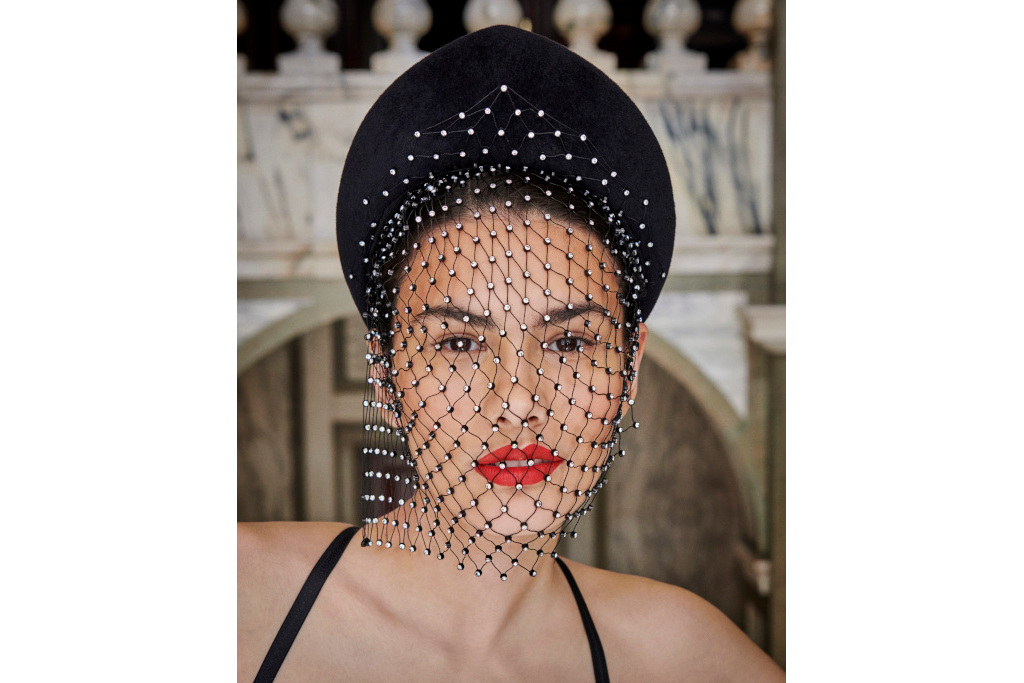 Woman in black hat with netting