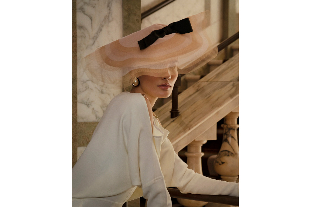 Model in tulle hat with black bow for Ascot