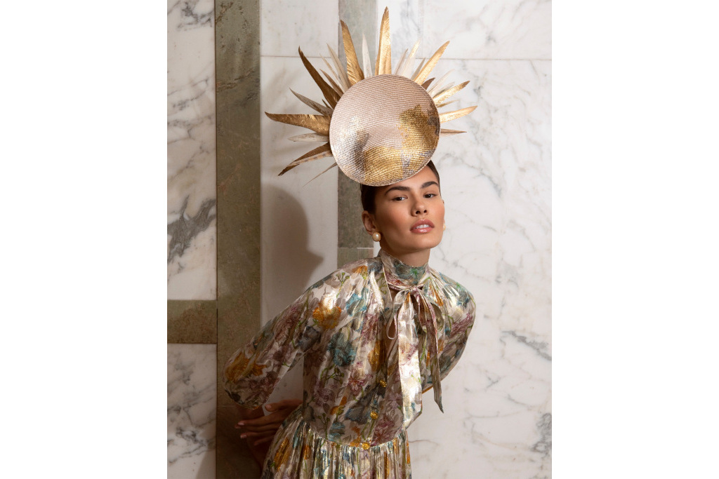 Model wearing sun-shaped hat