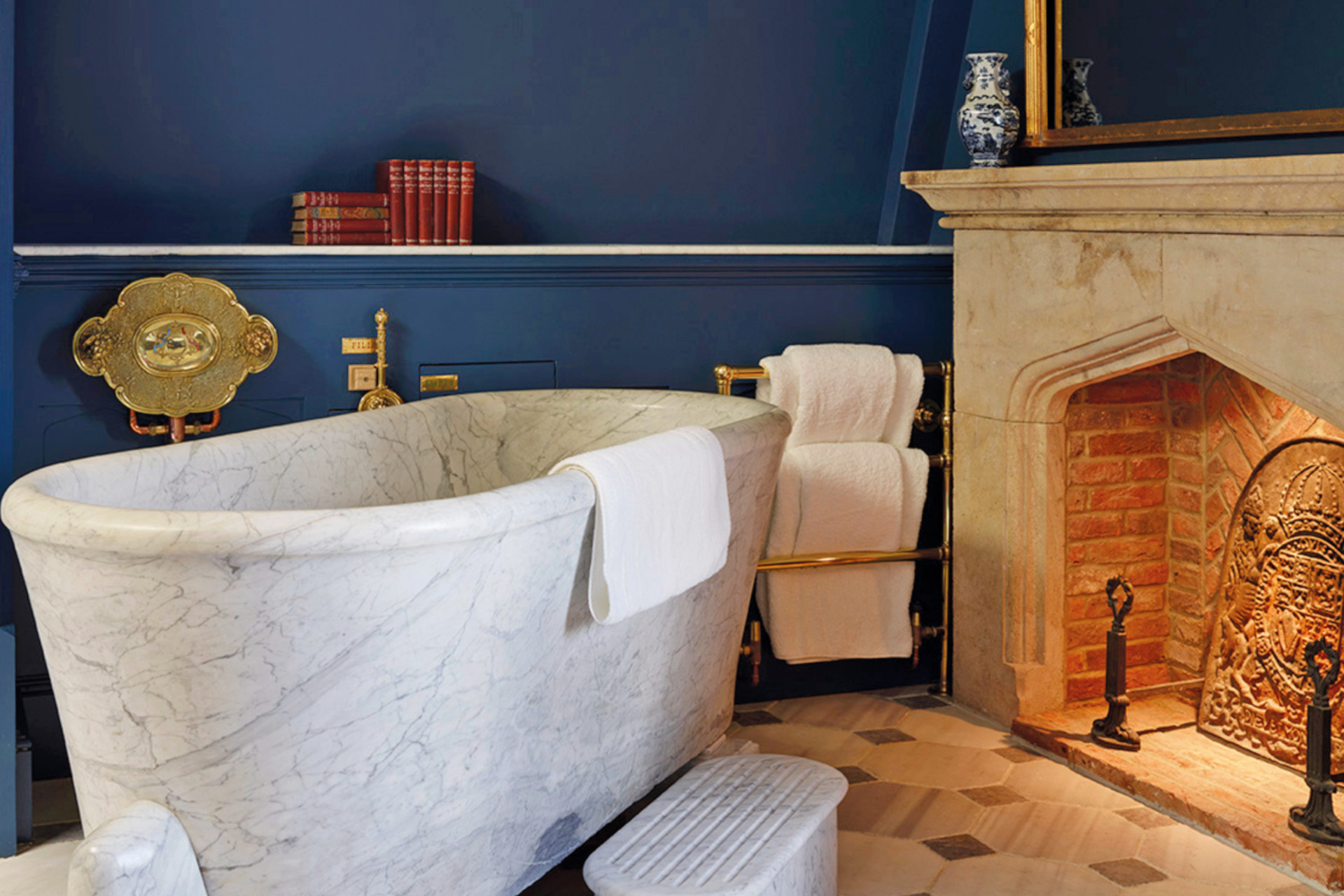 Standing marble bath with fireplace