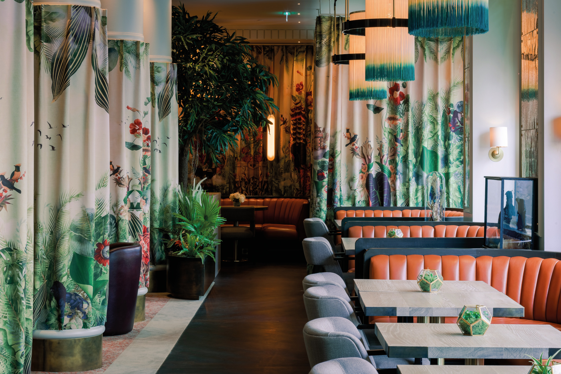 Botanical themed restaurant with floral patterned curtains