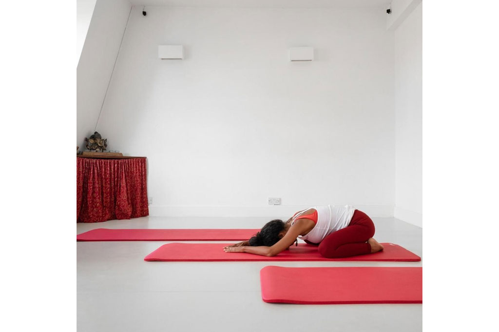Woman doing yoga | prenatal and postnatal fitness classes