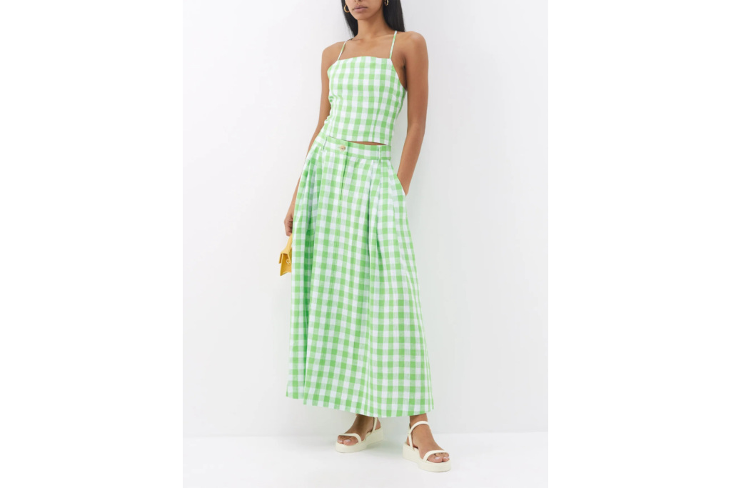 Woman in green top and skirt