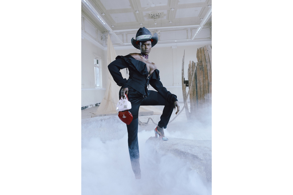 Model in black cowboy hat and clothing