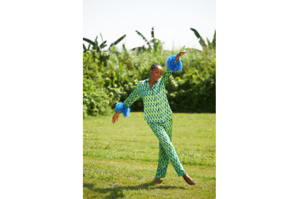 Woman outdoors in green and blue patterned pyjamas