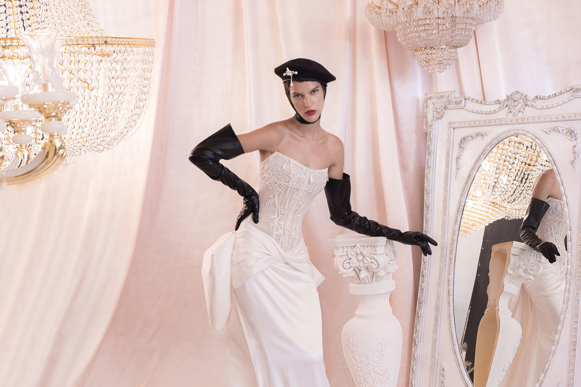 Model in bridal gown and black gloves