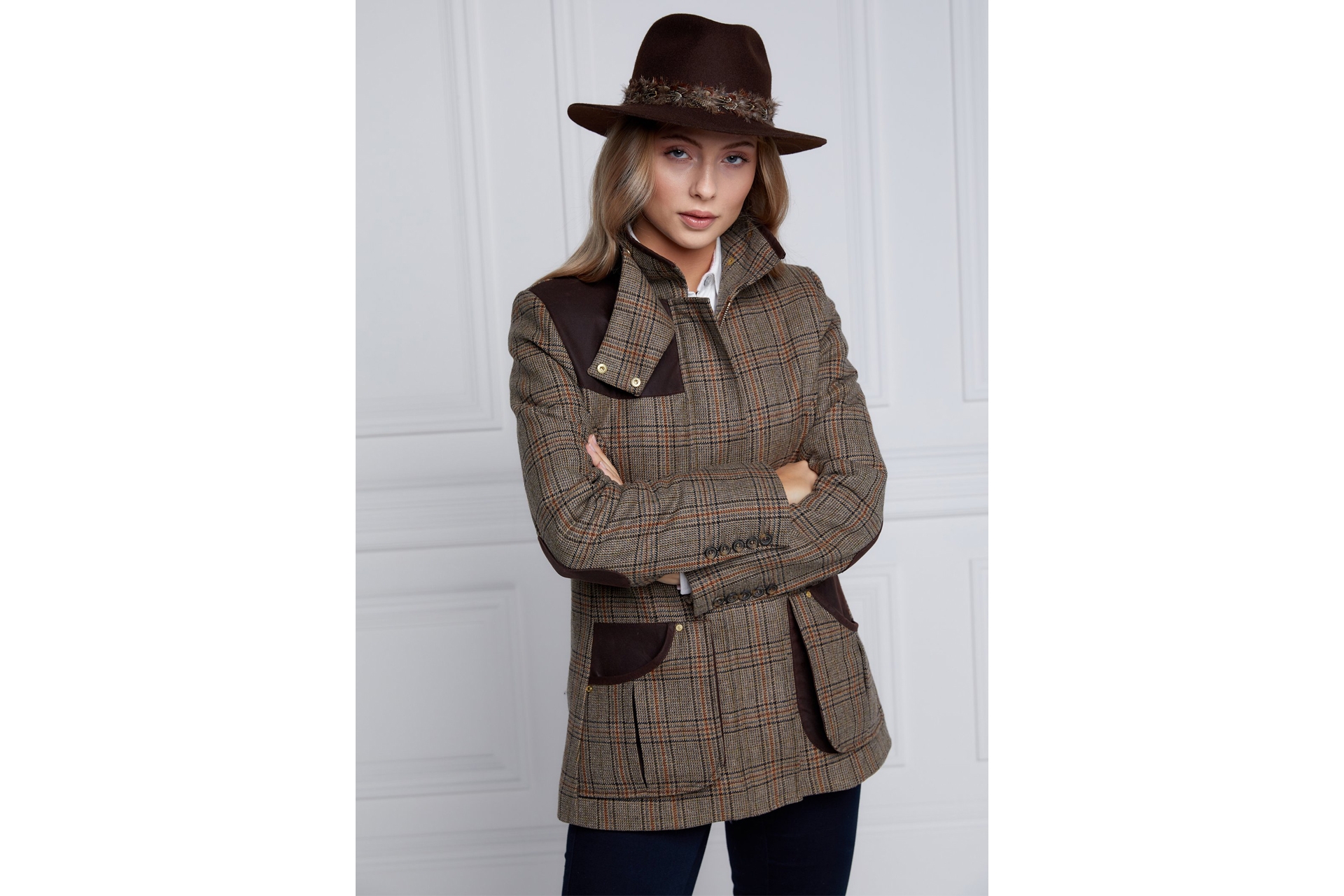 Woman in tweed coat and hat - British Sporting Brands