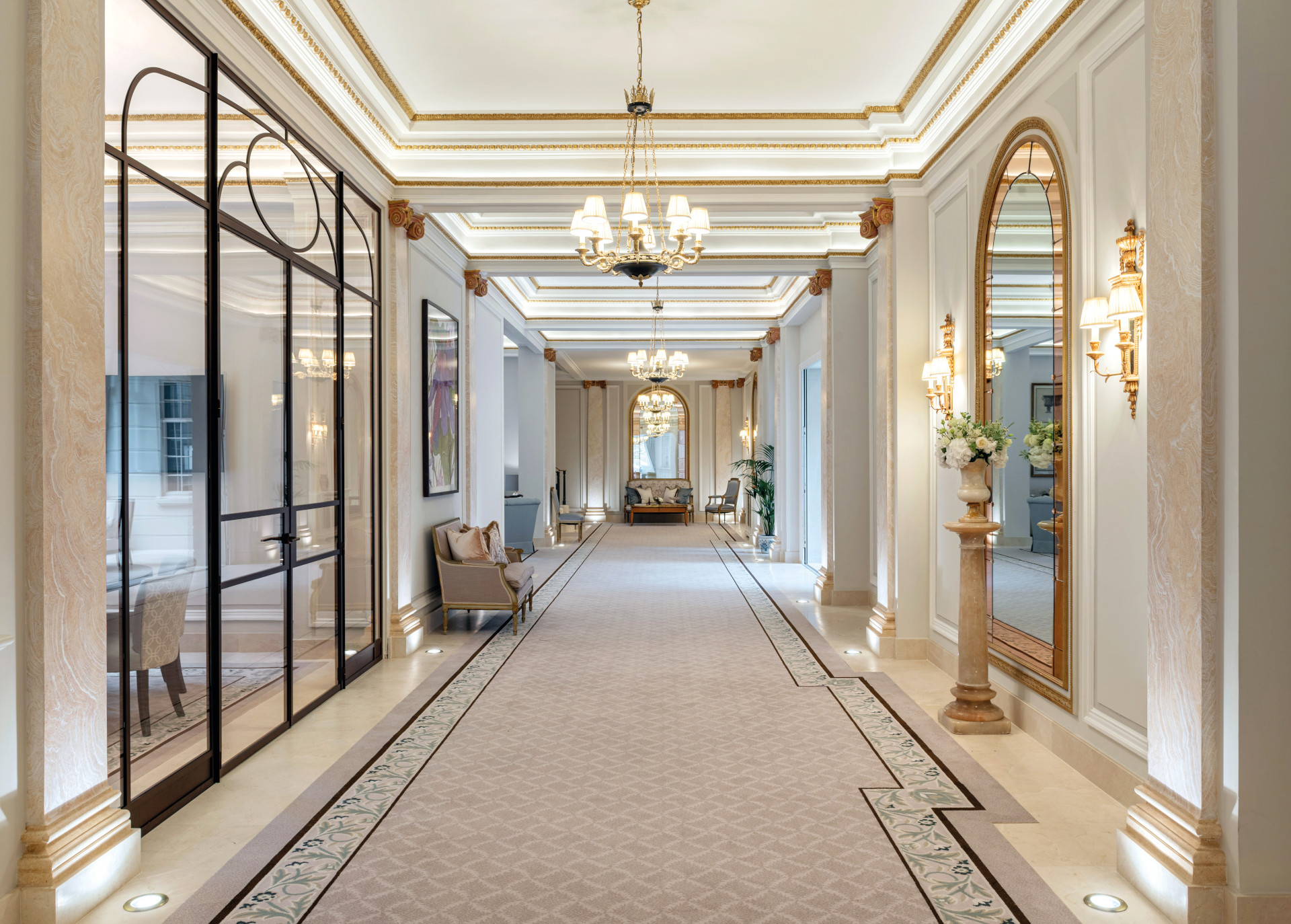 Corridor of a luxury apartment, with glass walls and mirrors