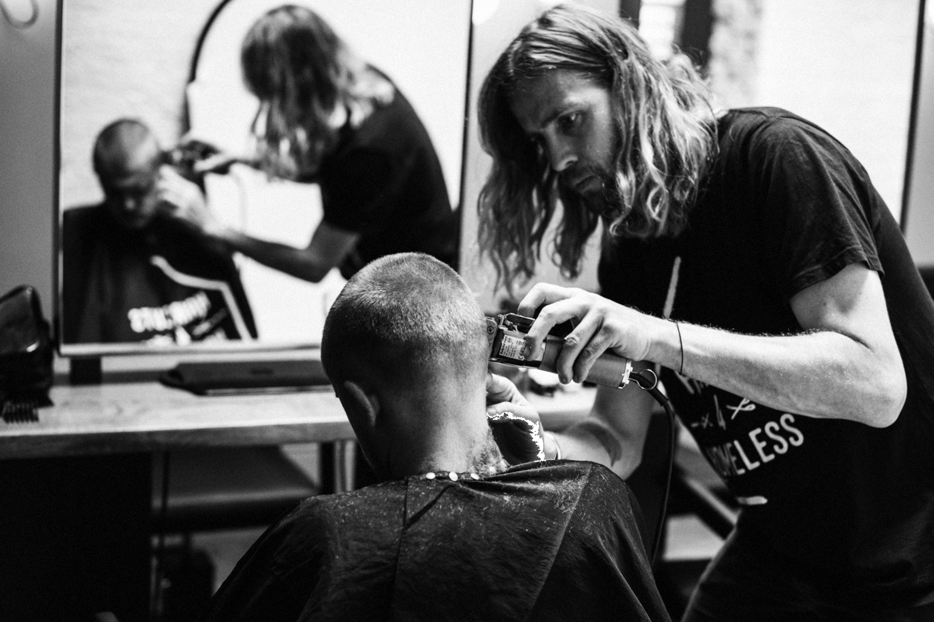 Haircuts4Homeless at British Beauty Week - a hair stylist giving a haircut