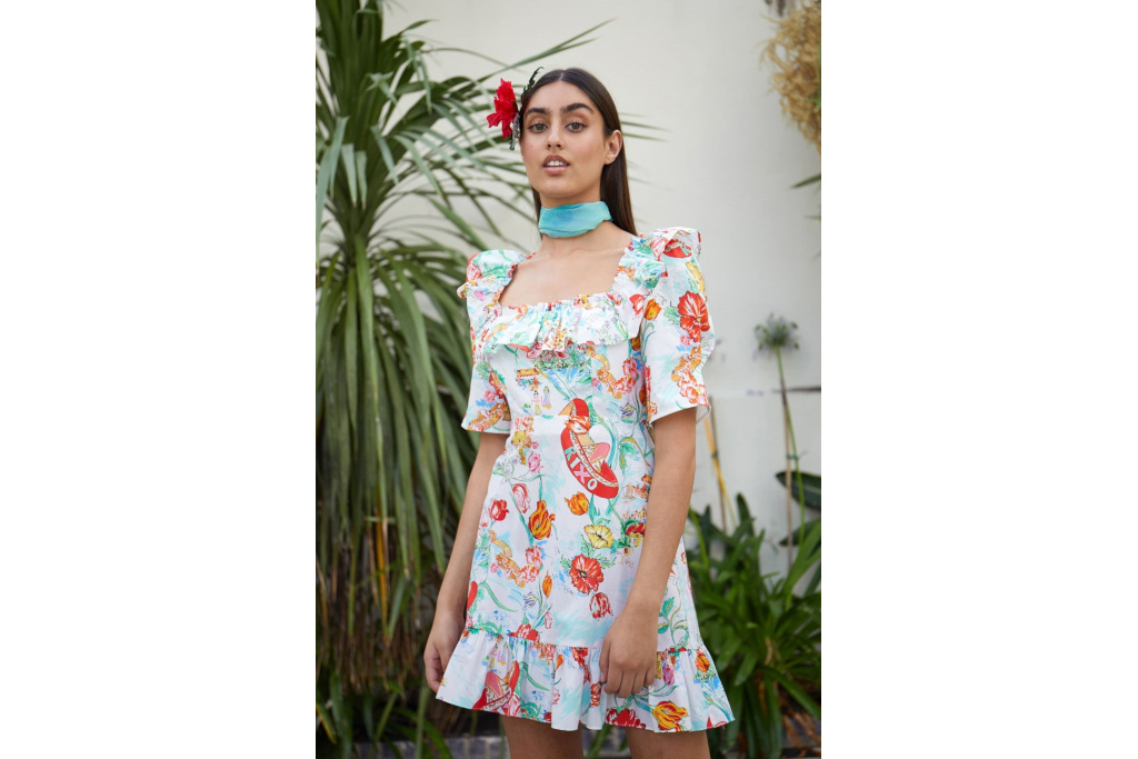 Model in a tropical print dress