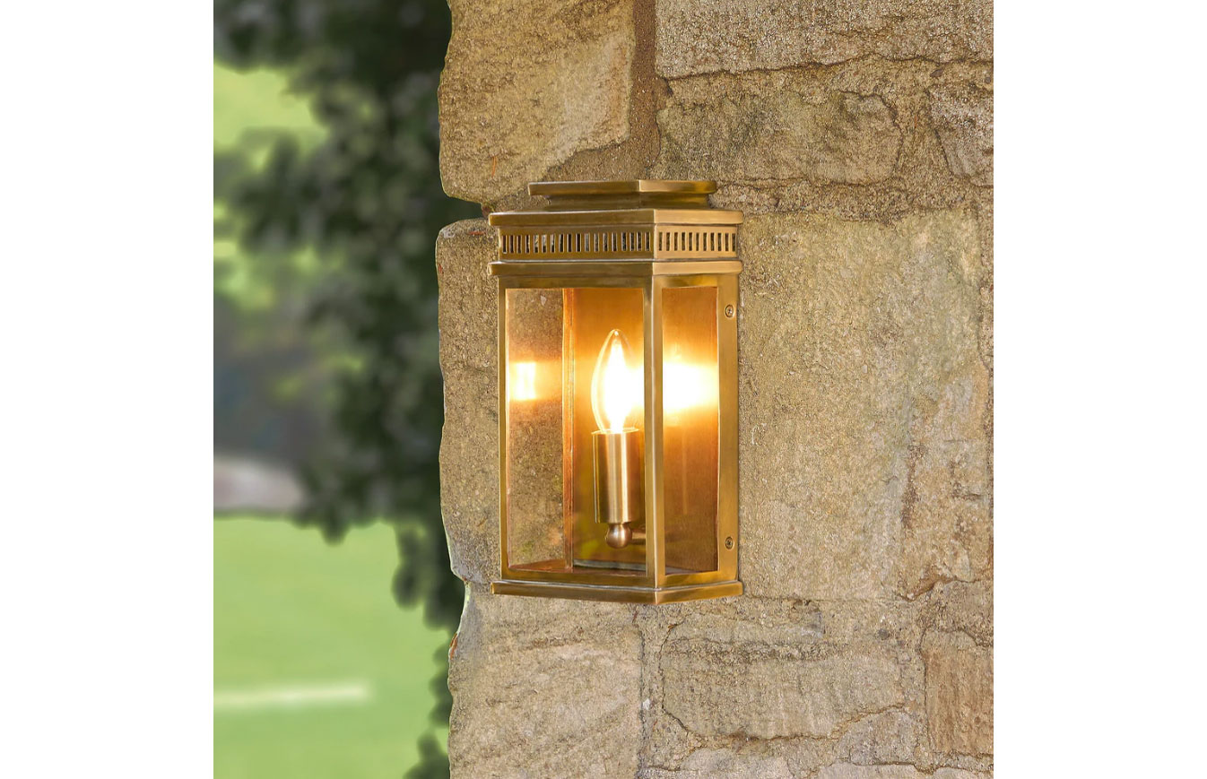 a golden outdoor lamp by Pooky