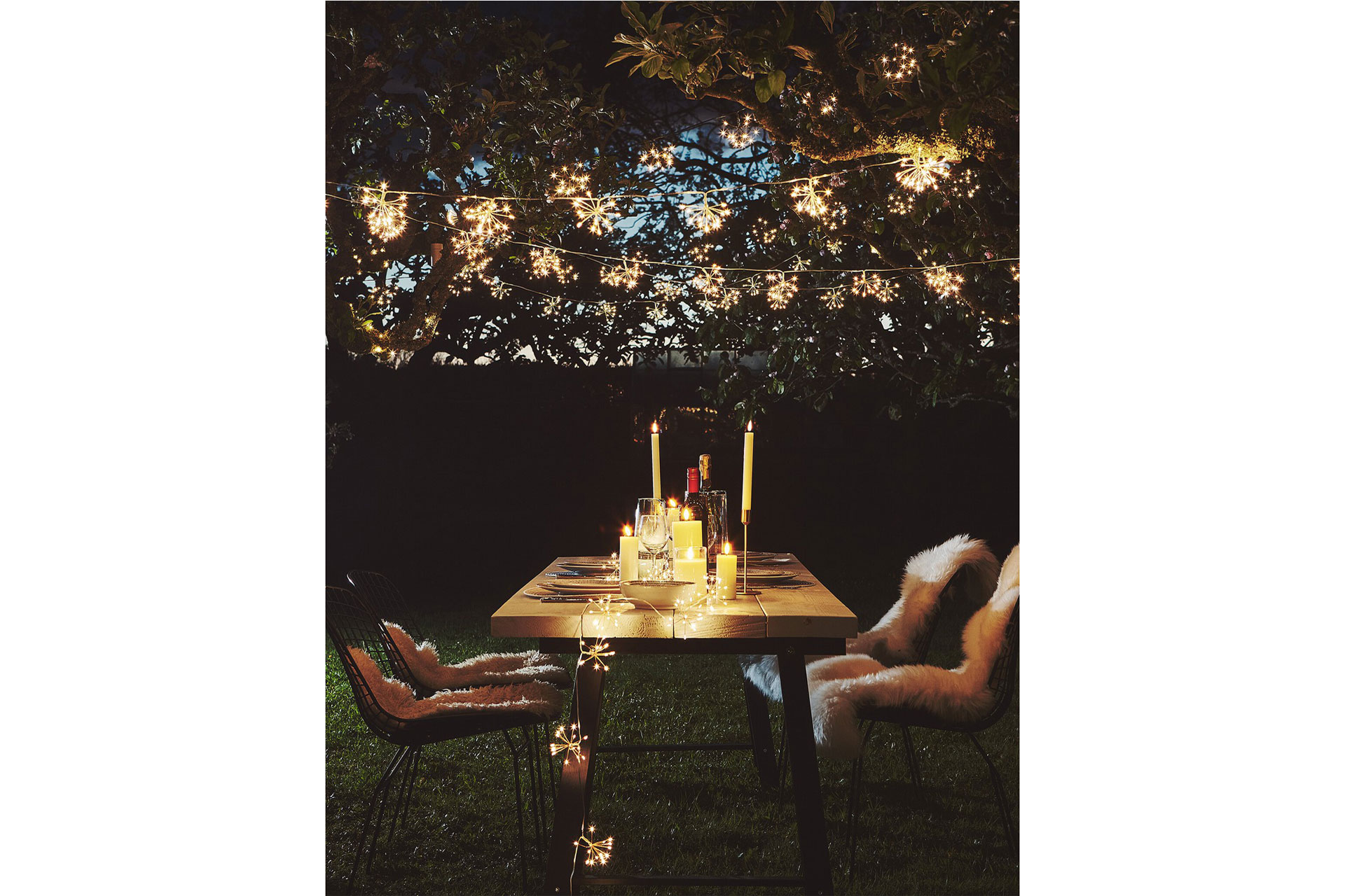 a night time scene with starburst fairy lights