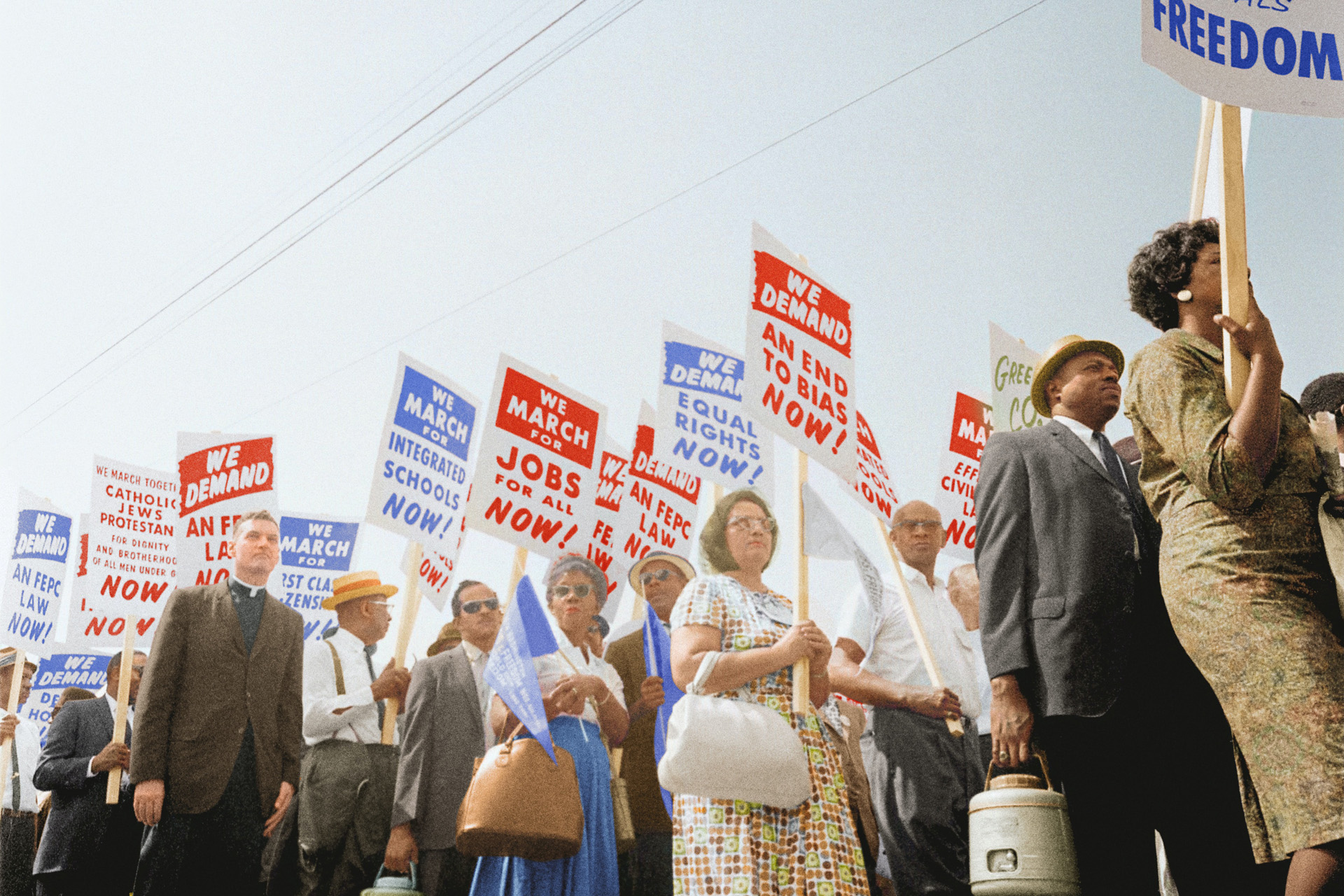 Black History Month: Demonstrators marching in the street holding signs during the March on Washington, 1963