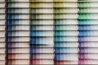 Paint swatches lined up on a wall (Luxury Paint Brands)