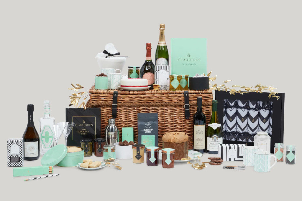 Bottles and confectionaries displayed around wicker hamper