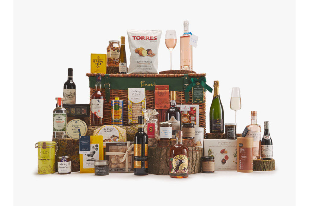 Drinks and Christmas-themed goodies on hamper