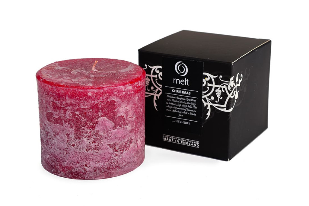 Red candle next to black box | Christmas scented candles