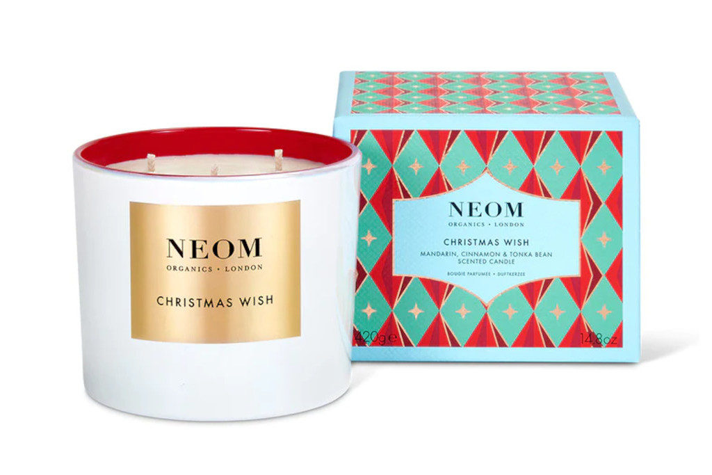 Candle next to multicoloured box