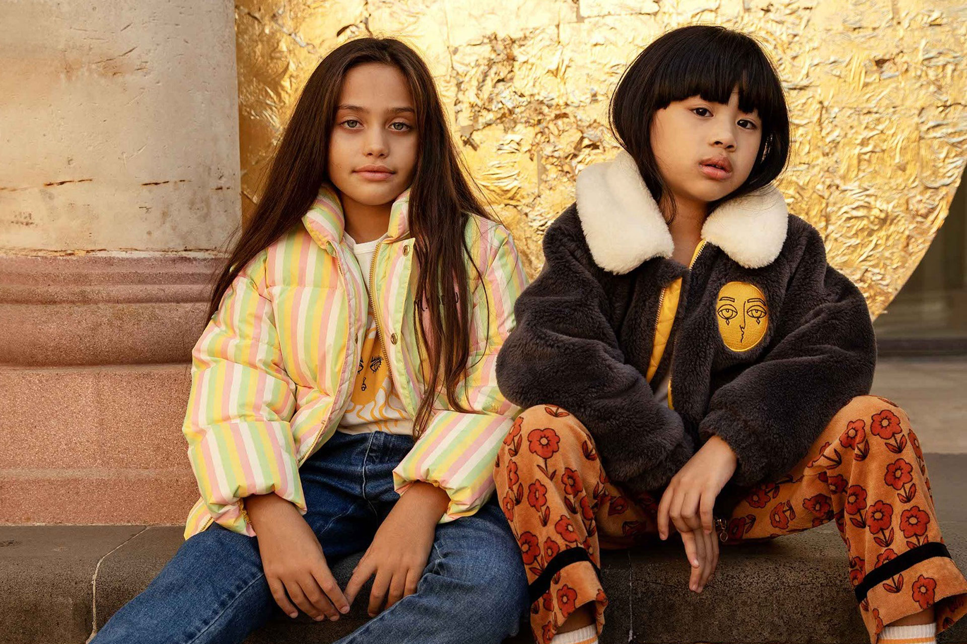 Two kids wearing sustainable clothing Mini Rodini
